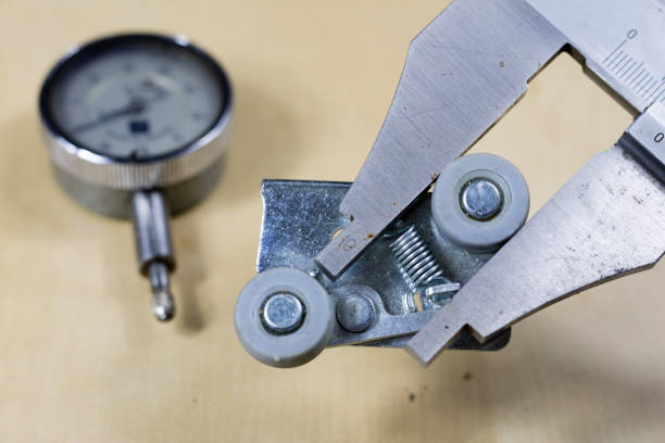 istock Tools and measuring accessories on a wooden workshop table. Performing control measurements using calipers, micrometers and other measuring accessories. 923776050