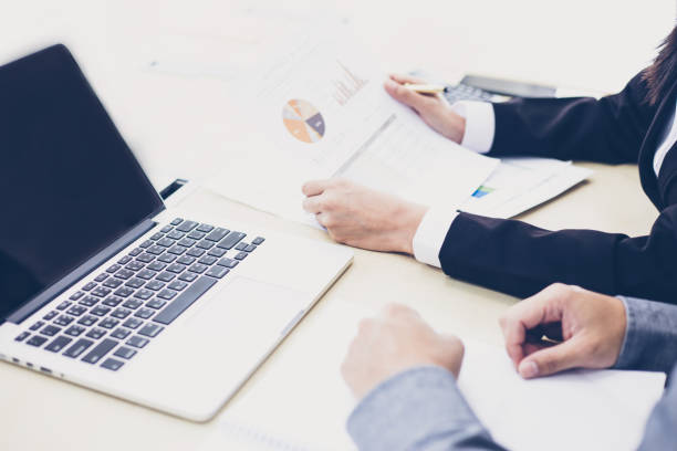 istock Midsection Of Business People Working At Table 923776234
