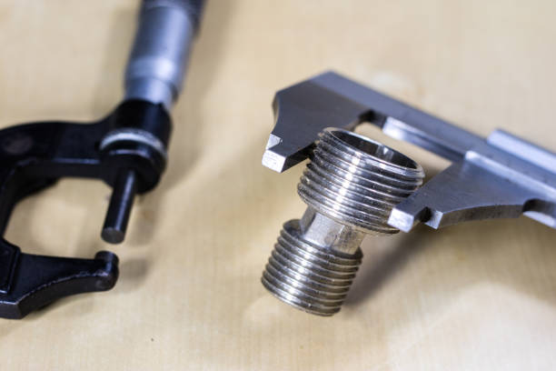 istock Tools and measuring accessories on a wooden workshop table. Performing control measurements using calipers, micrometers and other measuring accessories. 923776288