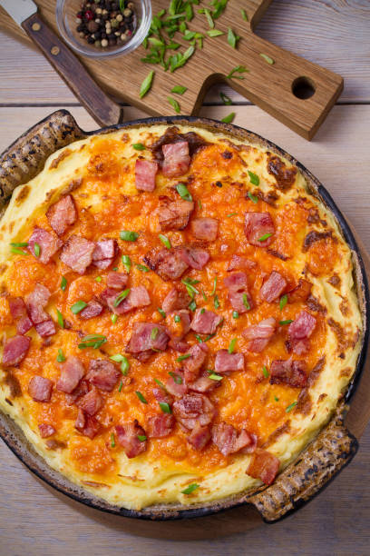 istock Cheddar Mashed Potato with Bacon Cooked in Oven. Baked Cheddar Potato Casserole 923776632