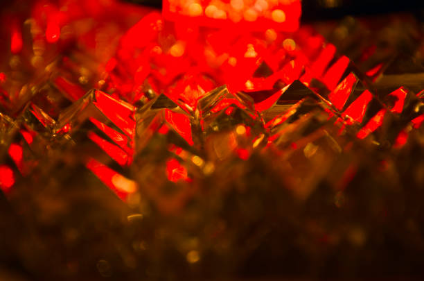 istock Close up of cut crystal facets in mysterious ruby light.Magic shiny background.Abstract. 923783372