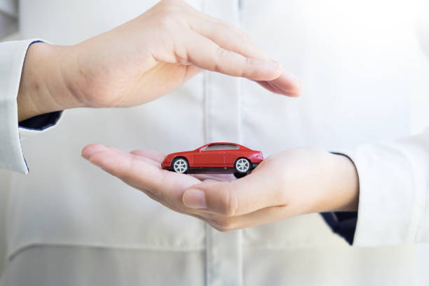 istock Midsection Of Man Holding Toy Car 923787856
