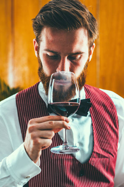 istock Close-Up Sommelier Looking At Wine In Glass 923788104