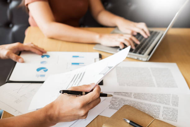 istock Cropped Image Of People Working At Desk In Office 923788186