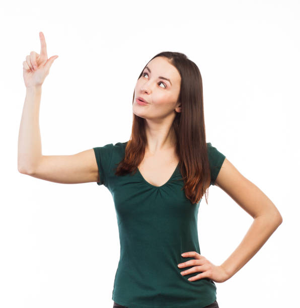 istock Pretty girl pointing up 923792802