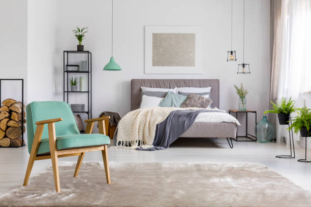 istock Spacious bedroom with armchair 923793128