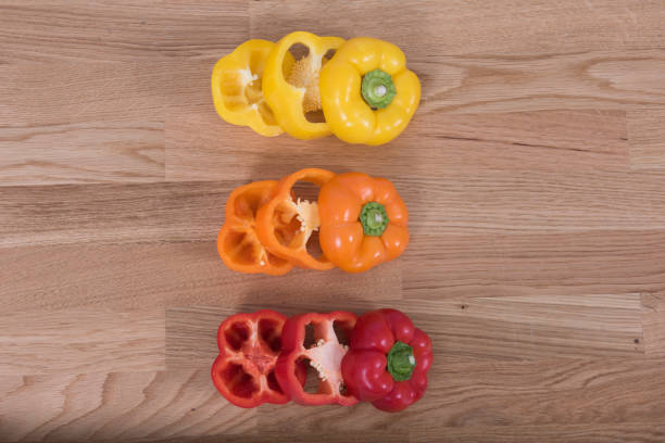 Multicoloured Peppers Orange, Yellow and Red. Sliced and arranged in an attractive style. Great for kitchen/food advertisement