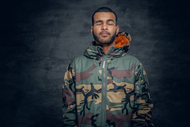 istock African American male dressed in a camouflage jacket. 923795776