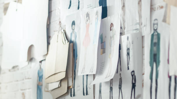 Wall with Pinned Fashion Drawings and Sketches, Templates Hanging on the Wall.