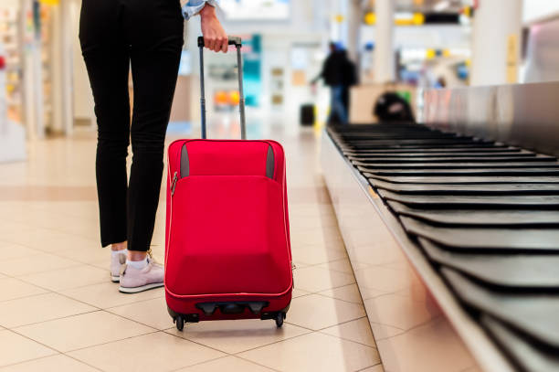 Woman carrying her trolley bag
