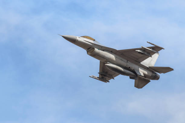 istock fighter jet military aircraft flying on blue sky 923799142