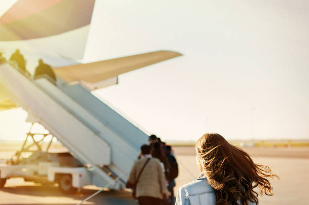 istock Pretty woman getting in to plane 923799196