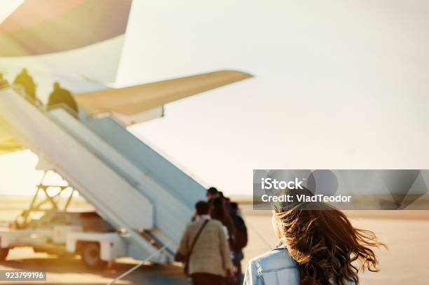 Pretty Woman Getting In To Plane Stock Photo - Download Image Now - Airplane, Airport, Boarding