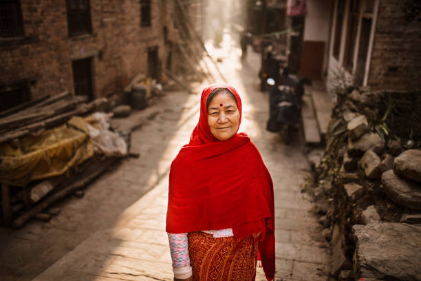 Aged women standing at street with winter cloth
