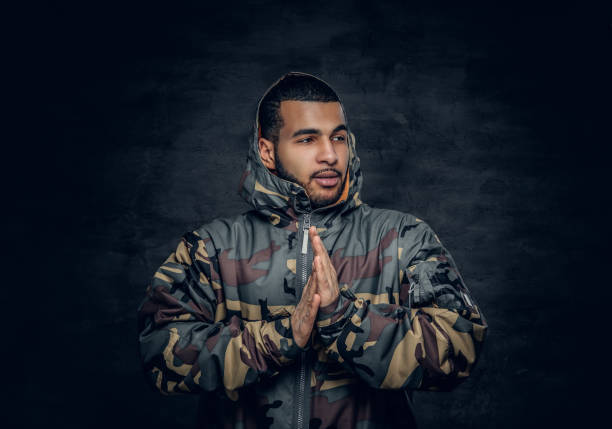 istock African American male dressed in a camouflage jacket. 923803302