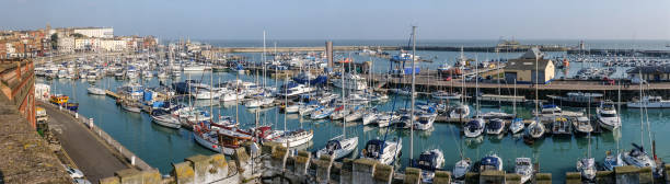 Panoramic of the Royal Harbour of Ramsgate Panoramic image of the impressive and historic Royal Harbour of Ramsgate, Kent, Uk. The marina was given its royal status by King George IV ramsgate stock pictures, royalty-free photos & images