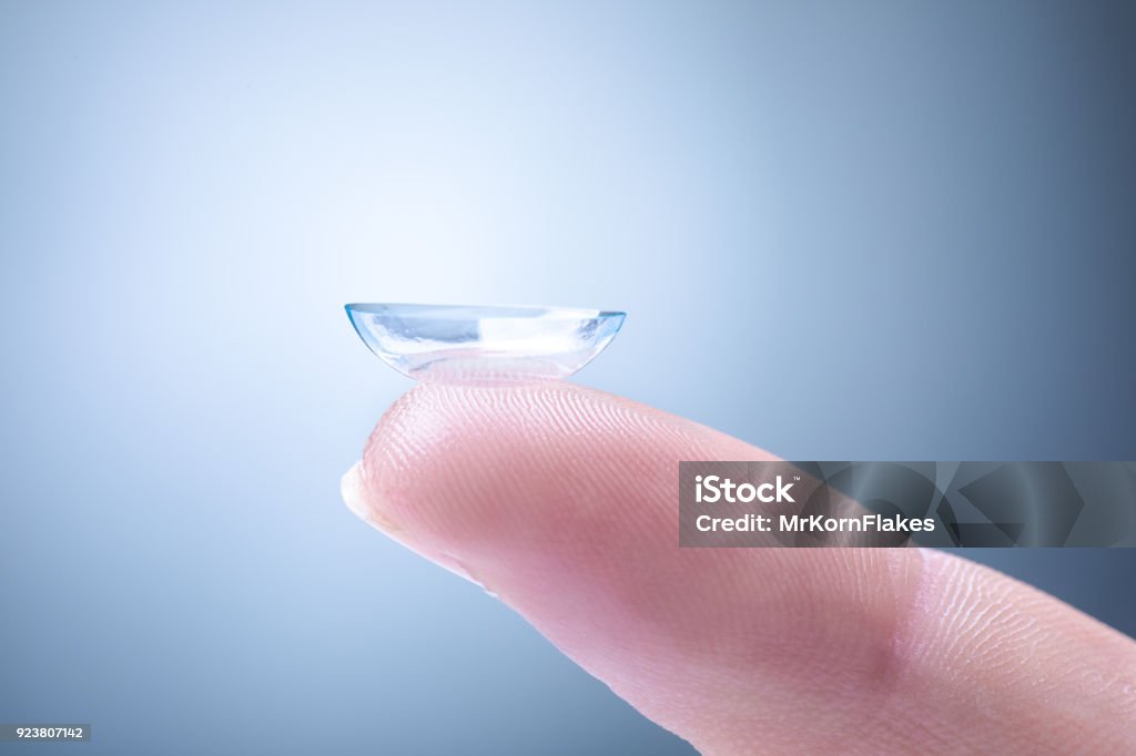 Contact Lens on a Finger Contact Lens on a Man's Index Finger Contact Lens Stock Photo