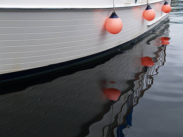 istock Three orange buoys on side of boat. 92380940