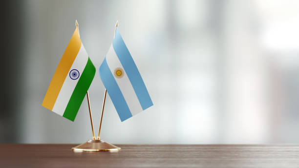 istock Argentinian And Indian Flag Pair On A Desk Over Defocused Background 923809918