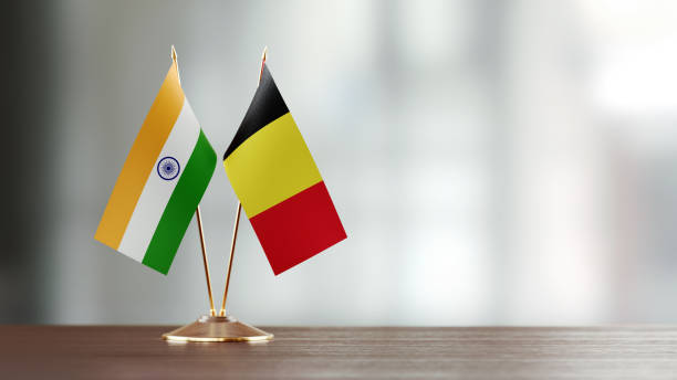 istock Indian And Belgian Flag Pair On A Desk Over Defocused Background 923813994