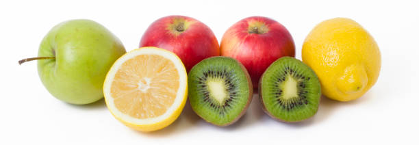 istock Fruits in a composition on a white background. Lemon with apples and kiwi on white background. Fruits with carrots on a white background. 923824406