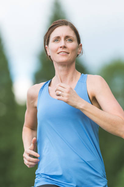 istock Woman Jogging in the Park 923827392