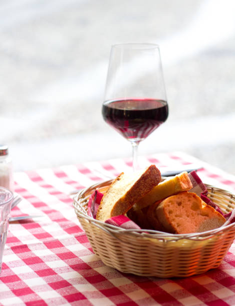 istock Italy: Glass of Wine and Breadbasket on Checked Tablecloth 923827640