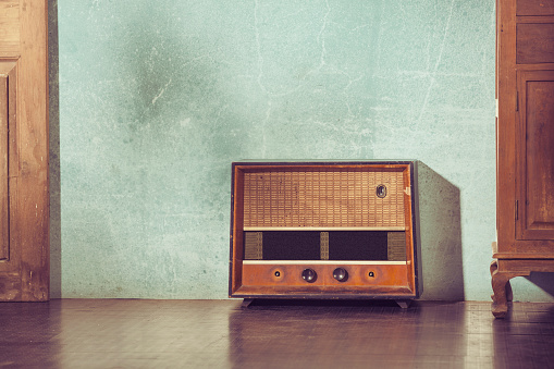 Antique wooden Radio on wall background