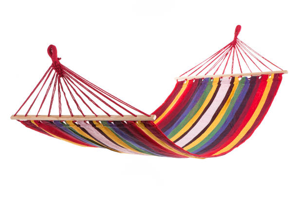 istock a multi-colored hammock made from natural fabric hanging on ropes, white background 923831776
