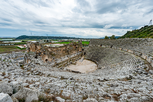 Lyon, France - October 30, 2012: Many tourists visit Roman Amphitheatre of the Three Gauls in Croix Rousse district. The oldest theater in ancient Gallo-Roman France shortly hold about 11,000 spectators. Numerous events take place throughout the year including the famous \