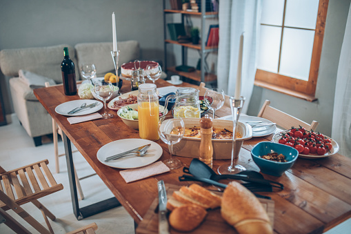 Beautiful arranged table for dinner party, dinner is served, no people.