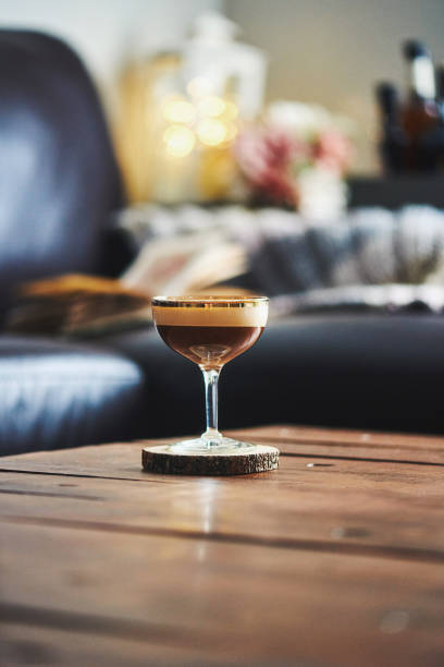istock Espresso martini cocktail on coffee table in indoor setting 923845344