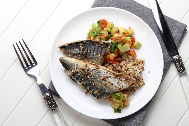 istock Grilled saury with kinoa and vegetable stew 923847506