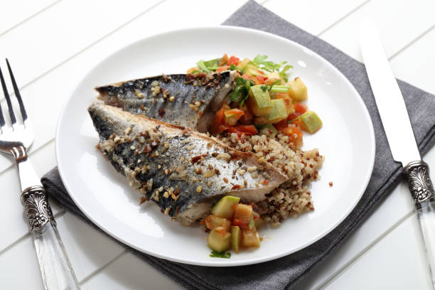 istock Grilled saury with kinoa and vegetable stew 923847508