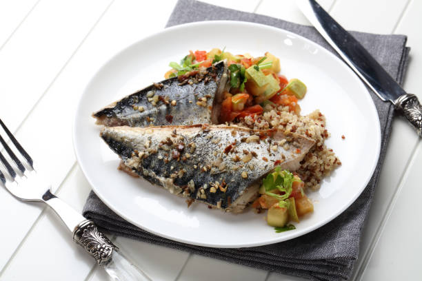 istock Grilled saury with kinoa and vegetable stew 923847556