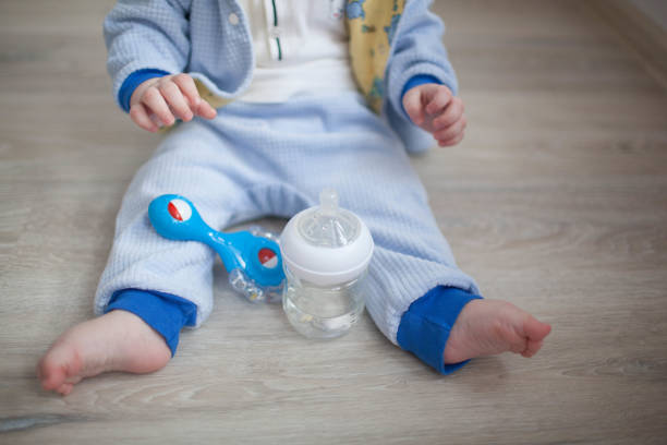 istock toddler sitting at the table and drinking milk 923848076
