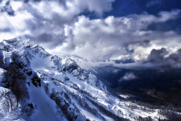 istock Beautiful winter landscape. Snow covered mountain peaks. Ski tracks. Evening time. 923864450