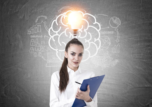 istock Young businesswoman writing, brain, idea 923871524