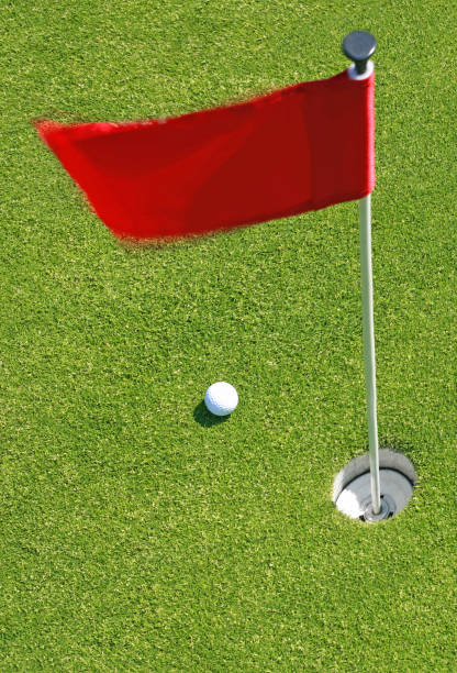 istock Golf ball on green with flag. 923871768