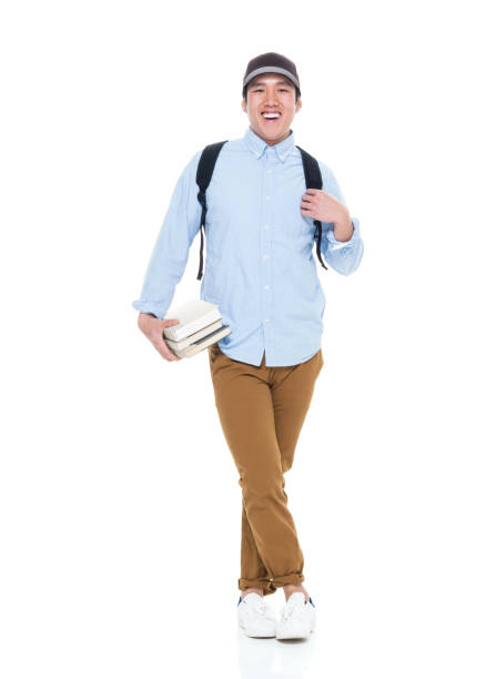 istock Happy Korean Male Student Standing With Books 923879678