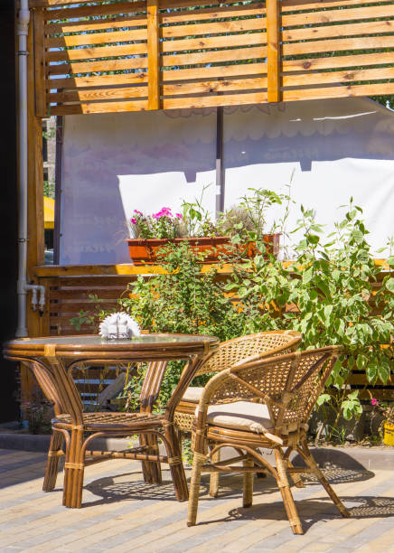 istock Wicker wooden table and chairs on terrace 923880508