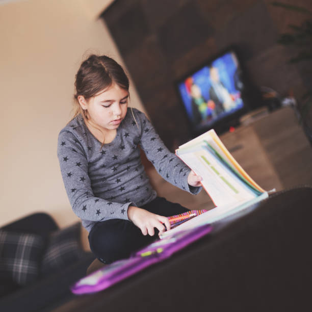 istock Young girl doing his school homework 923880718