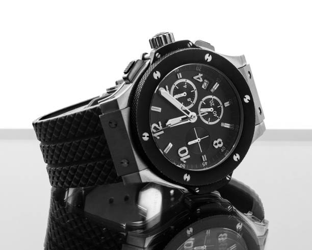 istock Gold modern watch on glass with reflection isolated on white black and white 923881064
