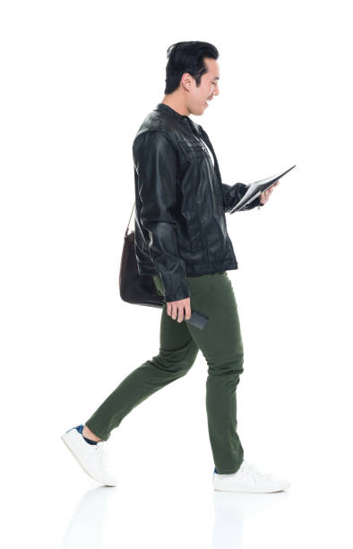 istock Handsome Korean male holding phone and documents 923883958