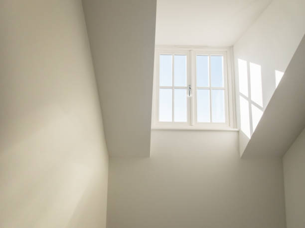 istock high dormer window acting as a sky light in a hall way shedding natural light into a residential home 923884606