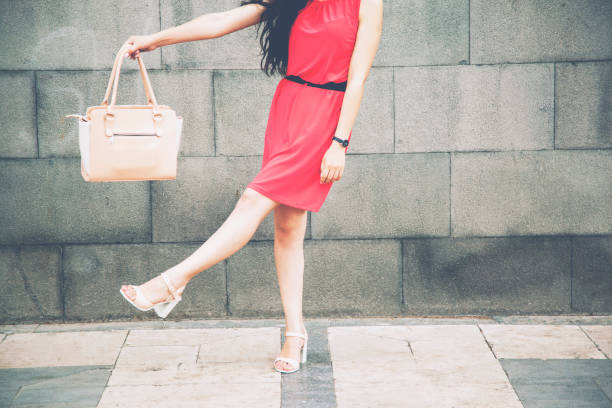 istock happy woman hand hanbag 923891942