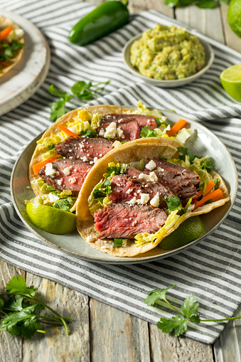 Homemade Korean Steak Tacos with Cabbage Cilantro and Cheese