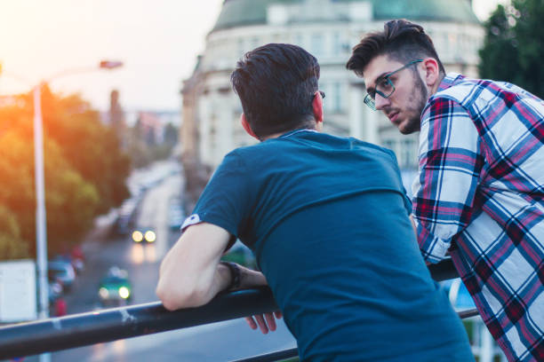 istock Two men relaxing in city view. 923899062
