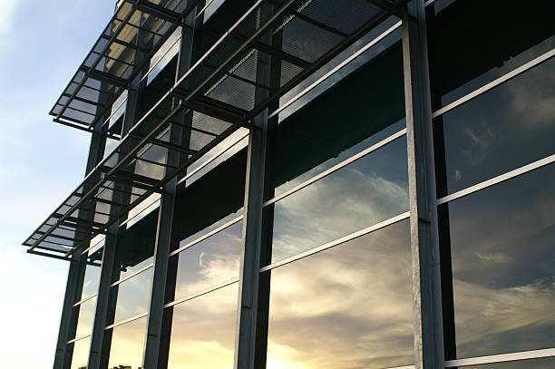 istock Office building in early morning reflecting sky in glass windows 92390768