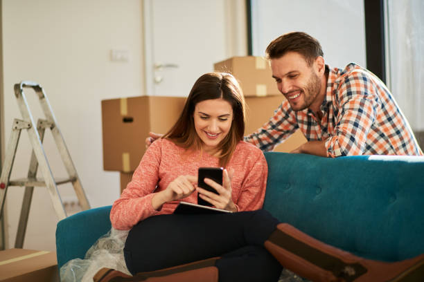 istock Couple in new apartment 923908234